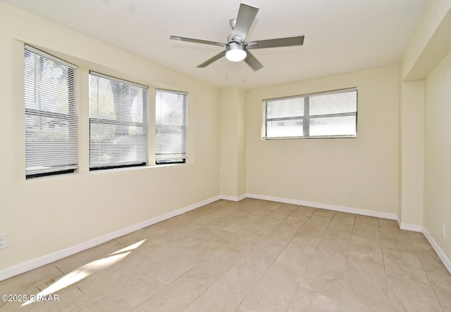 unfurnished room featuring baseboards, a healthy amount of sunlight, and ceiling fan