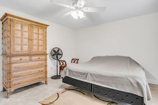 bedroom featuring a ceiling fan and baseboards