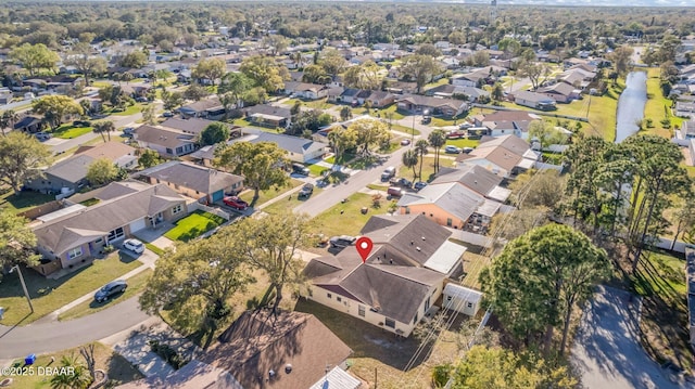 birds eye view of property with a residential view