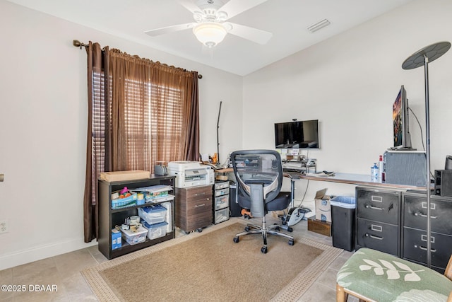 office space featuring baseboards, tile patterned flooring, visible vents, and a ceiling fan