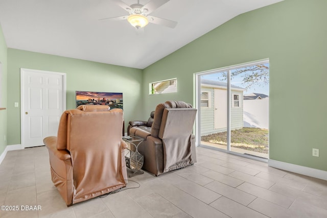 interior space with light tile patterned floors, vaulted ceiling, baseboards, and ceiling fan