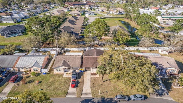 birds eye view of property with a residential view