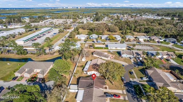 drone / aerial view with a residential view and a water view