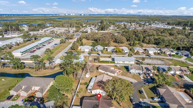 bird's eye view featuring a residential view and a water view