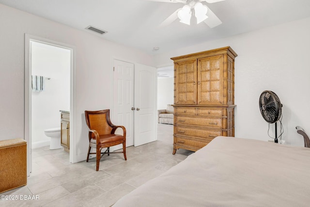 bedroom with visible vents, ceiling fan, and ensuite bath