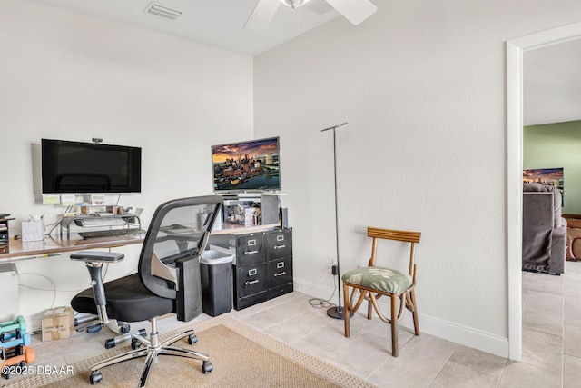 office area featuring light tile patterned floors, ceiling fan, visible vents, and baseboards