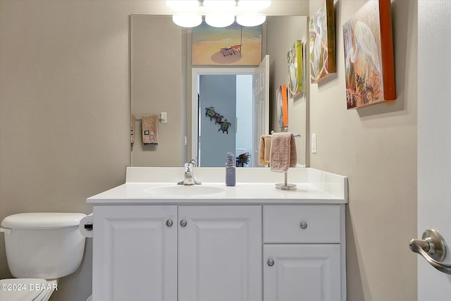 bathroom featuring toilet and vanity