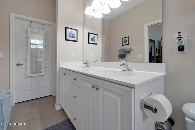 bathroom with tile patterned floors, vanity, and toilet