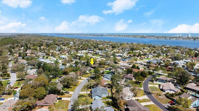 drone / aerial view featuring a residential view and a water view