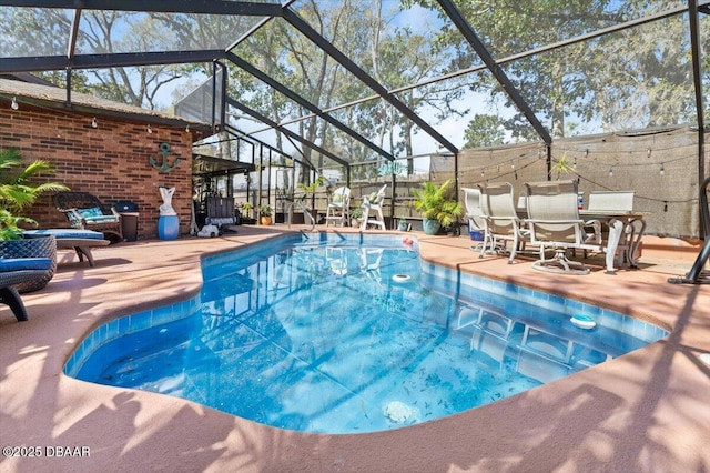 outdoor pool featuring a lanai and a patio area