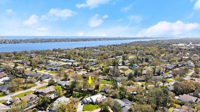 drone / aerial view with a residential view and a water view