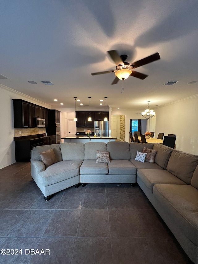 tiled living room featuring ceiling fan with notable chandelier and ornamental molding