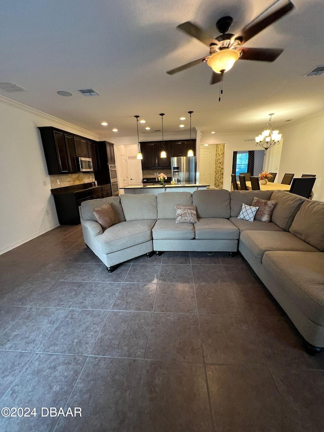 tiled living room with crown molding and ceiling fan with notable chandelier