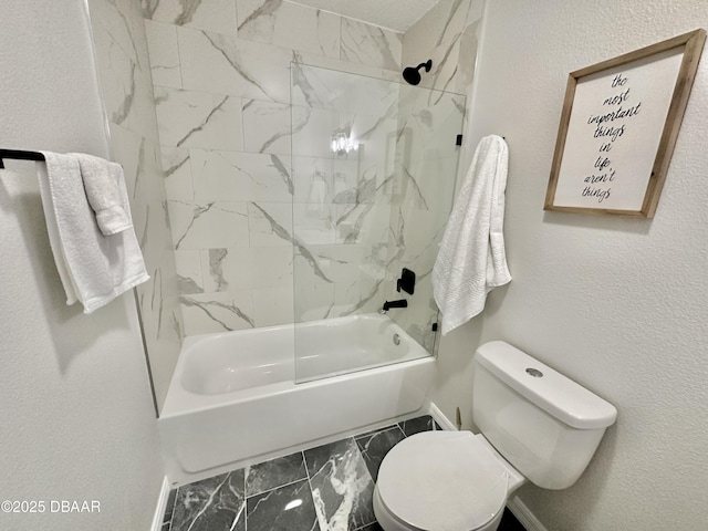 full bathroom featuring baseboards,  shower combination, marble finish floor, and toilet