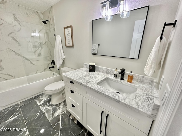 full bathroom with vanity, toilet, a textured ceiling, marble finish floor, and shower / bathing tub combination