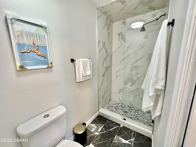 bathroom with toilet, baseboards, a marble finish shower, and marble finish floor