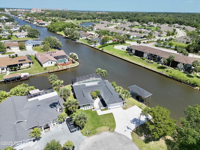 bird's eye view with a residential view and a water view
