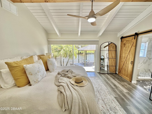 bedroom featuring visible vents, wood finished floors, access to outside, a barn door, and wooden ceiling