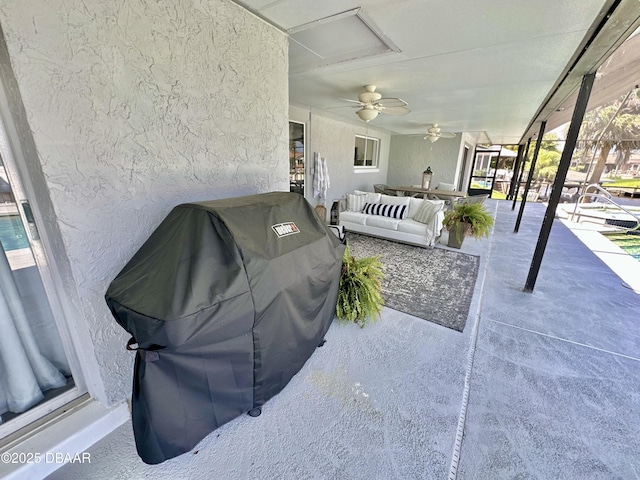 view of patio / terrace featuring ceiling fan, area for grilling, and outdoor lounge area