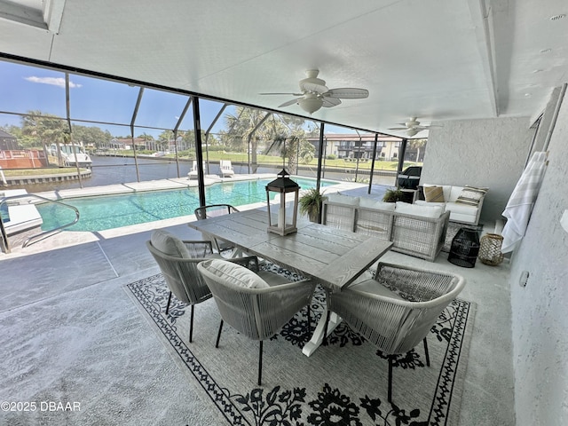 view of patio featuring a lanai, ceiling fan, outdoor dining space, and an outdoor pool