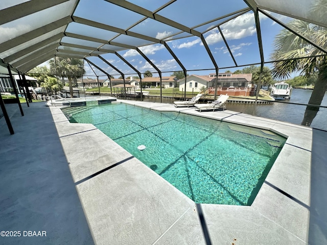 outdoor pool featuring a patio area, a lanai, and a residential view