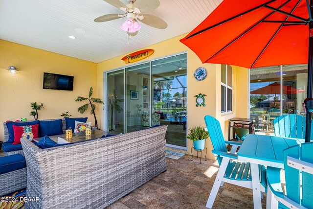 1078 Castaway Ct, Daytona Beach, FL 32124 - view of patio with an outdoor hangout area, outdoor dining area, and a ceiling fan