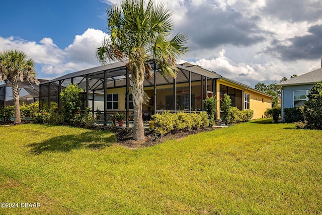 1078 Castaway Ct, Daytona Beach, FL 32124 - rear view of house featuring a lawn