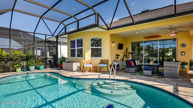 1078 Castaway Ct, Daytona Beach, FL 32124 - outdoor pool featuring a patio area, ceiling fan, outdoor lounge area, and glass enclosure