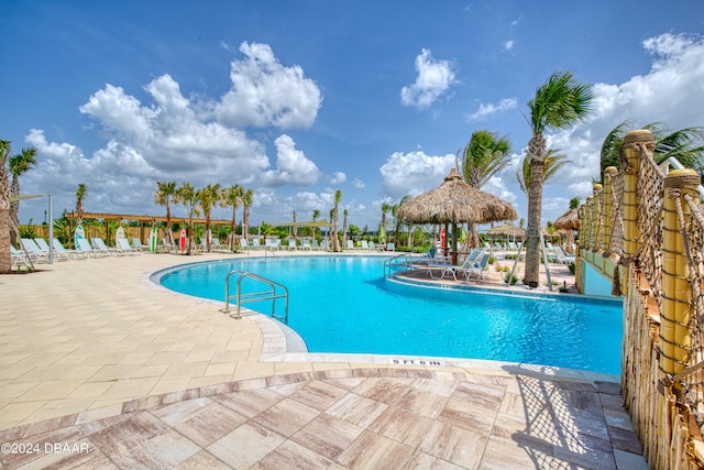 view of swimming pool with a patio area and a gazebo