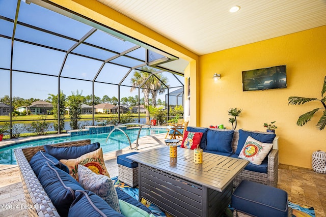 view of pool featuring an outdoor hangout area, a patio, a lanai, and pool water feature