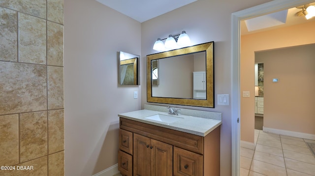 bathroom with tile patterned flooring and vanity