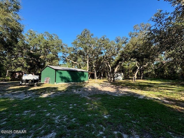 17531 NE 139th Ave, Fort Mccoy, FL 32134 - view of grassy yard featuring an outbuilding
