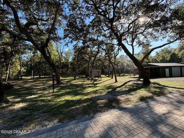 17531 NE 139th Ave, Fort Mccoy, FL 32134 - view of green lawn featuring a shed
