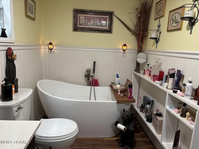 17531 NE 139th Ave, Fort Mccoy, FL 32134 - full bathroom with a wainscoted wall, a freestanding bath, and wood finished floors