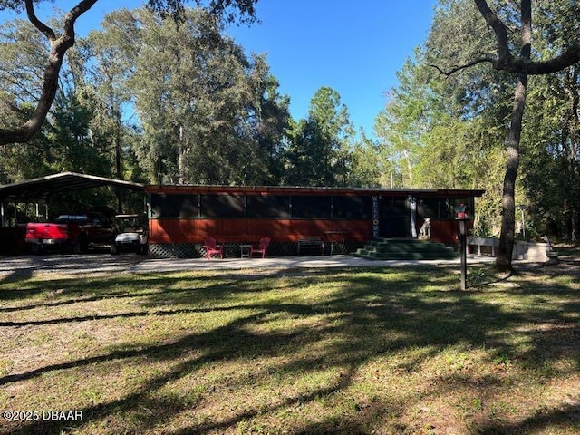 17531 NE 139th Ave, Fort Mccoy, FL 32134 - back of property featuring a lawn and a carport