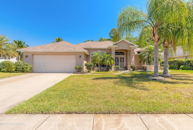 ranch-style house with a front yard, driveway, a garage, and stucco siding