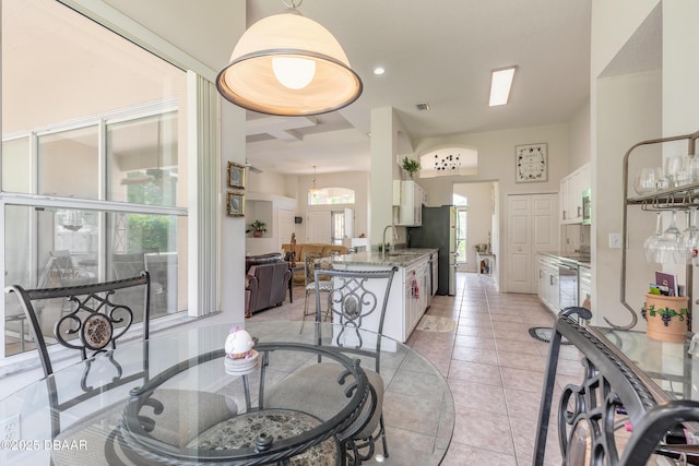 dining area featuring light tile patterned flooring