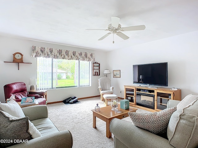 living room featuring ceiling fan and carpet