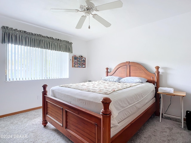 bedroom featuring ceiling fan and light colored carpet