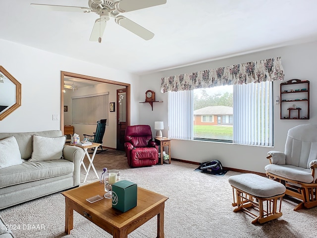 living room featuring carpet and ceiling fan