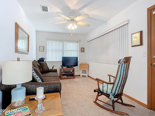 living room featuring carpet flooring and ceiling fan