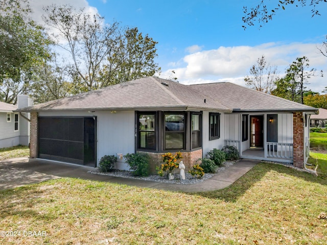 rear view of property featuring a lawn