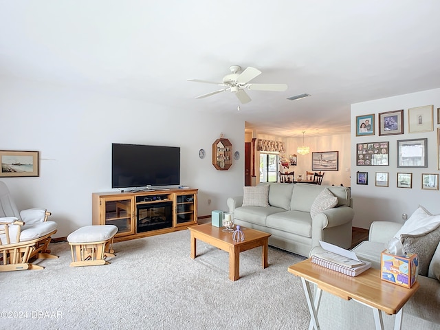 carpeted living room featuring ceiling fan