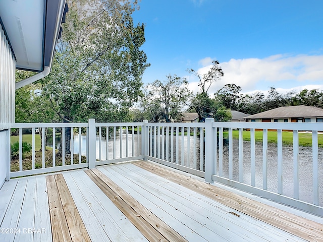 wooden deck featuring a water view