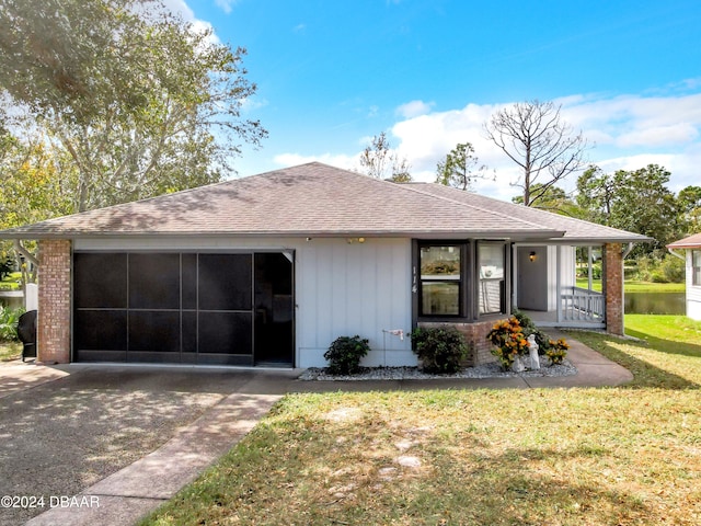 ranch-style home with covered porch and a front yard