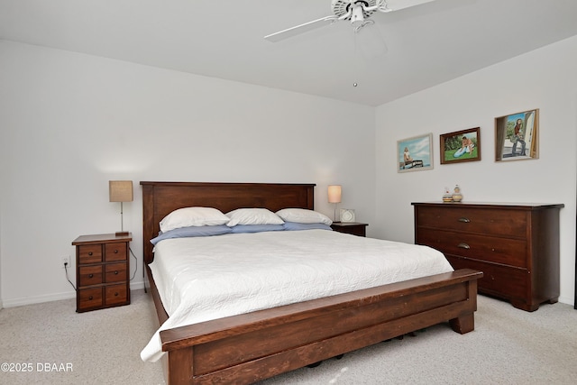 bedroom with ceiling fan and light carpet