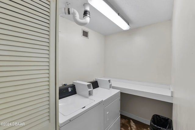 laundry area featuring independent washer and dryer