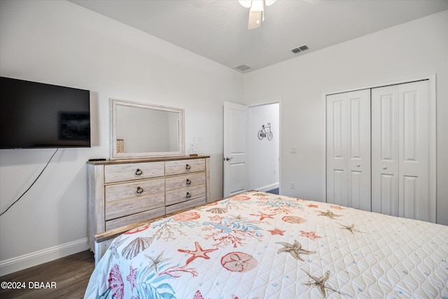 bedroom with ceiling fan, dark hardwood / wood-style floors, and a closet