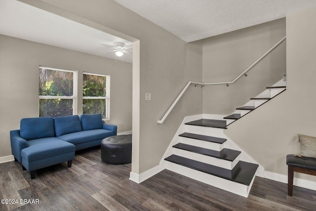 interior space with a textured ceiling, hardwood / wood-style flooring, and ceiling fan