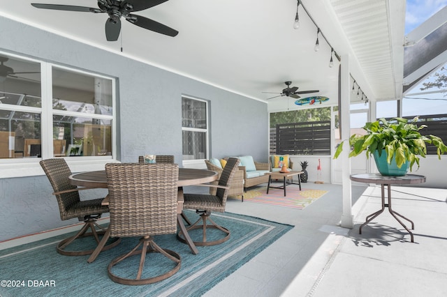 view of patio / terrace featuring ceiling fan